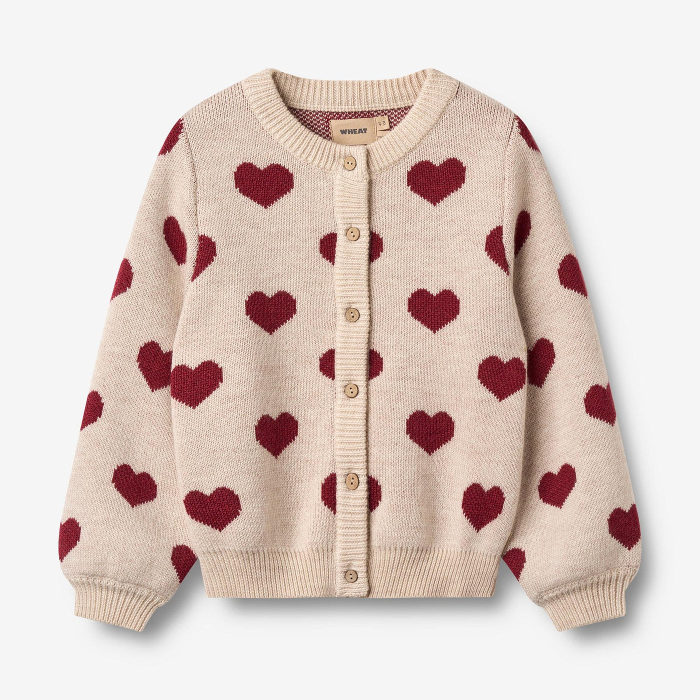 Jaquard Cardigan, Hearts, Merino Wool fra Wheat

Denne langærmede strikcardigan til børn er strikket i en dejlig blød uldkvalitet og har en behagelig, normal til let løs pasform.