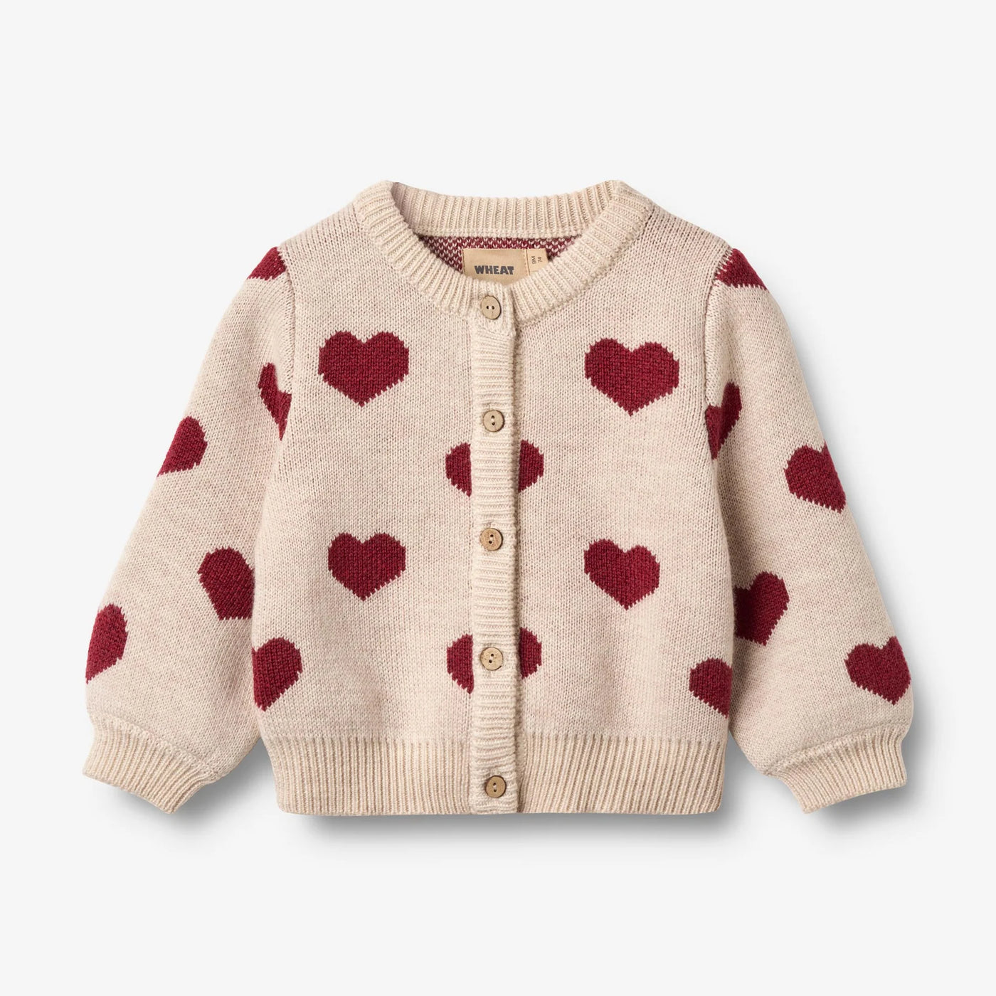 Jaquard Cardigan, Hearts, OffWhite, Merino Wool fra Wheat

Denne langærmede strikcardigan til børn er strikket i en dejlig blød uldkvalitet og har en behagelig, normal til let løs pasform. 