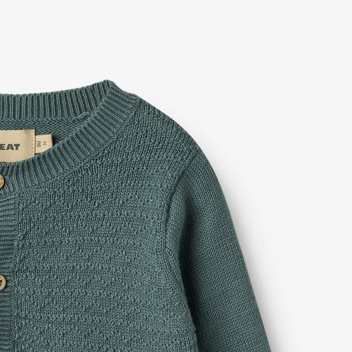 Strikket Cardigan, Bjørn, Stormy fra Wheat

Lækker langærmet strikcardigan i blød økologisk bomuld fra Wheat.
