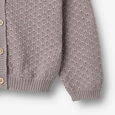 Strikket Cardigan, Magnella, Dusty Purple fra Wheat

Langærmet strikcardigan i blødt økologisk bomuld til børn.