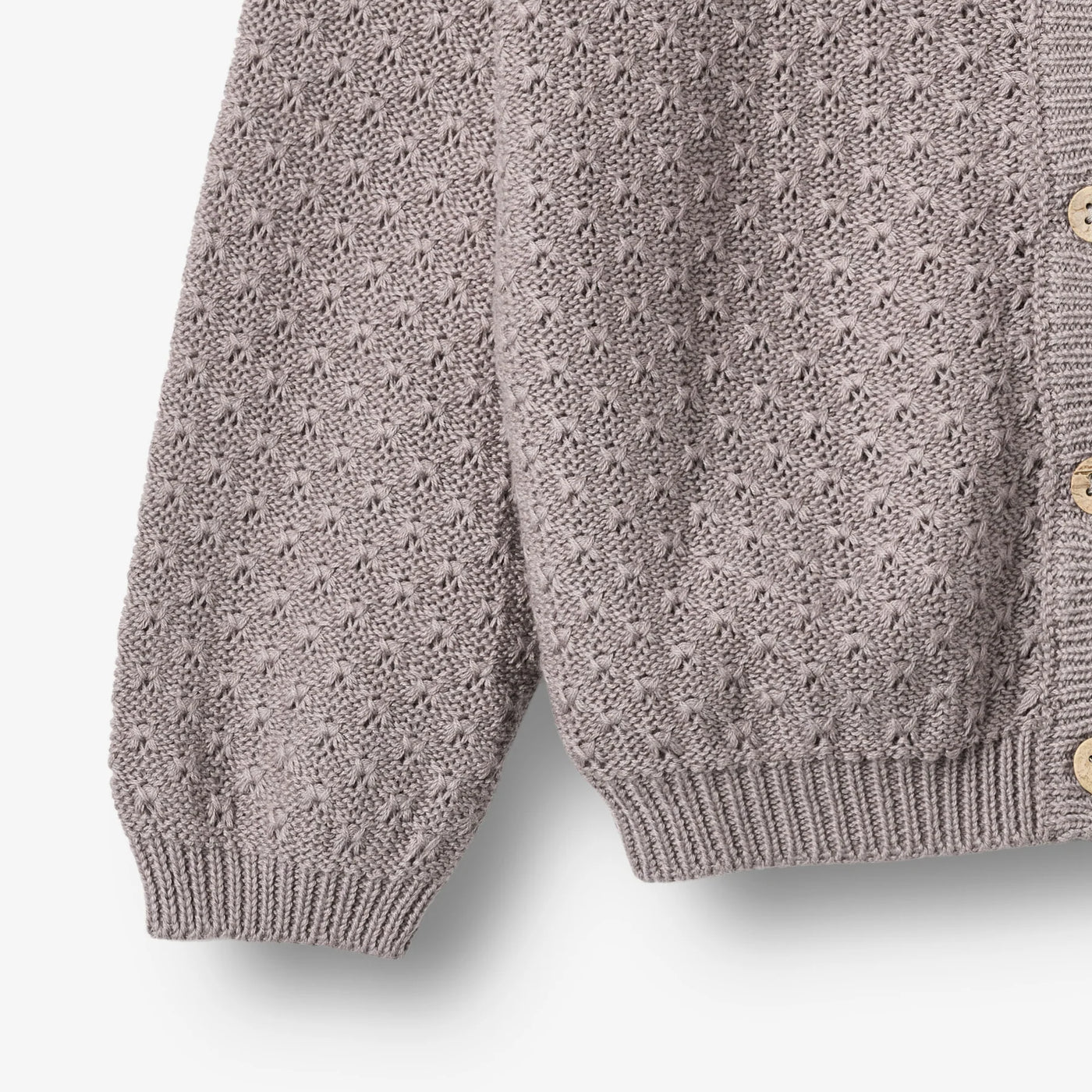Strikket Cardigan, Magnella, Dusty Purple fra Wheat

Langærmet strikcardigan i blødt økologisk bomuld til børn.
