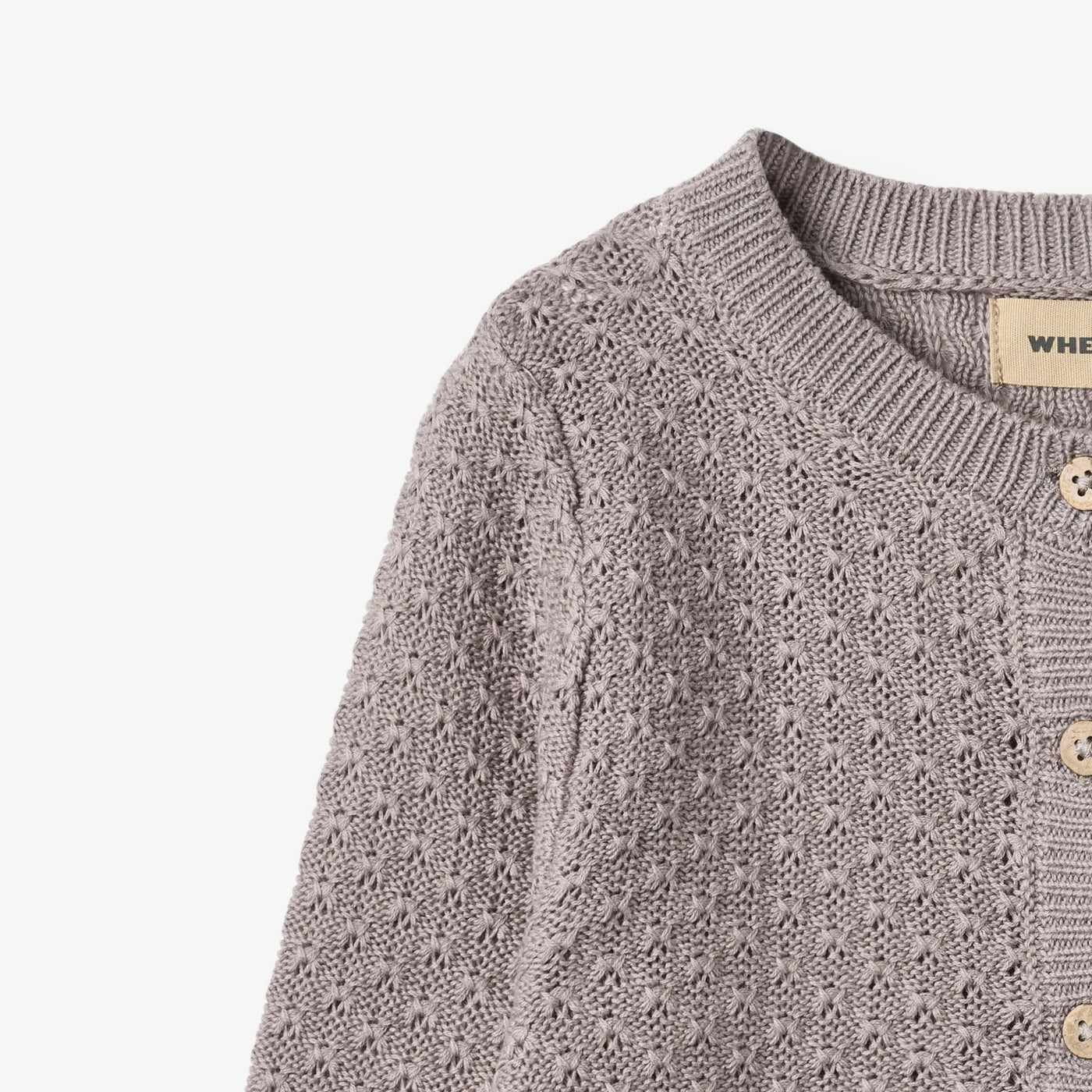 Strikket Cardigan, Magnella, Dusty Purple fra Wheat

Langærmet strikcardigan i blødt økologisk bomuld til børn.