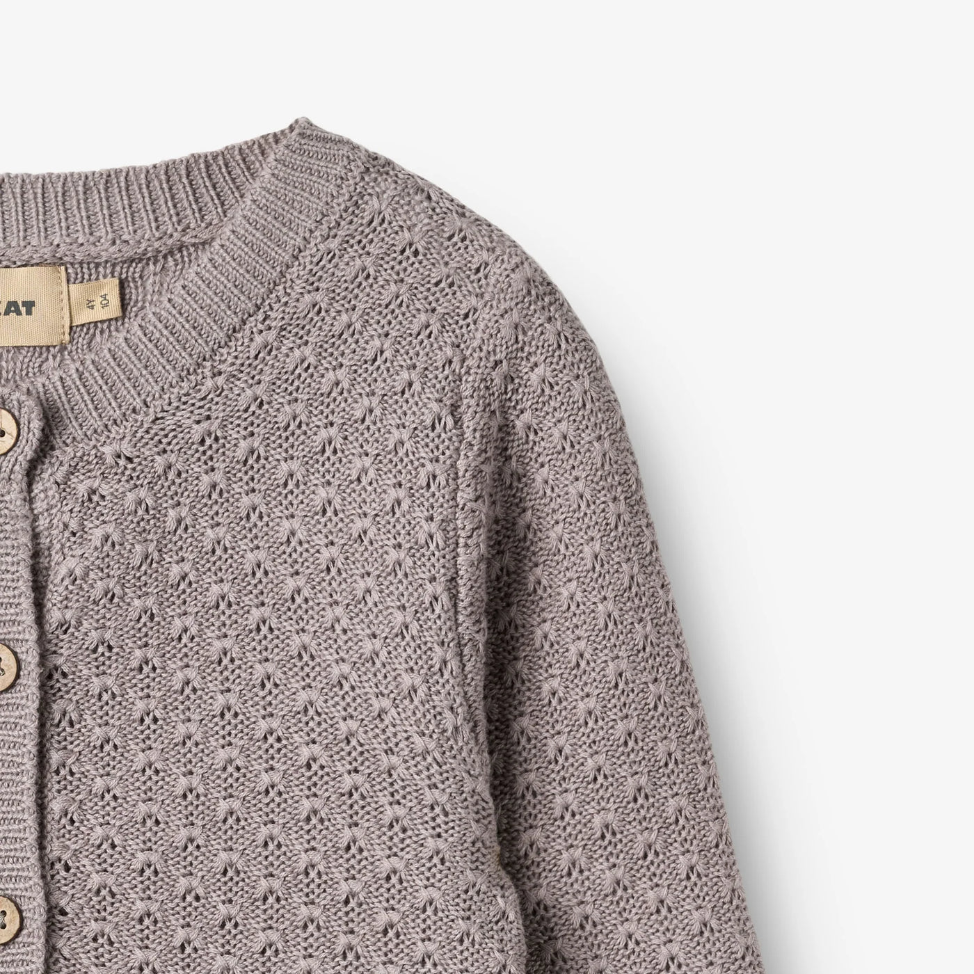 Strikket Cardigan, Magnella, Dusty Purple fra Wheat

Langærmet strikcardigan i blødt økologisk bomuld til børn.